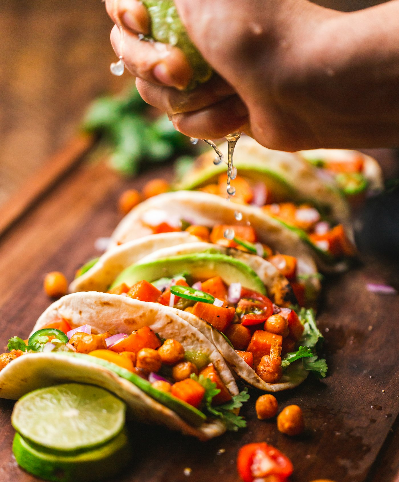 Lime squeezed over colourful tacos